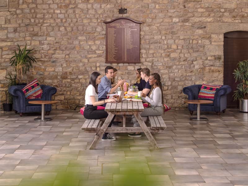Group of students sitting together at Barker House Farm college cafe